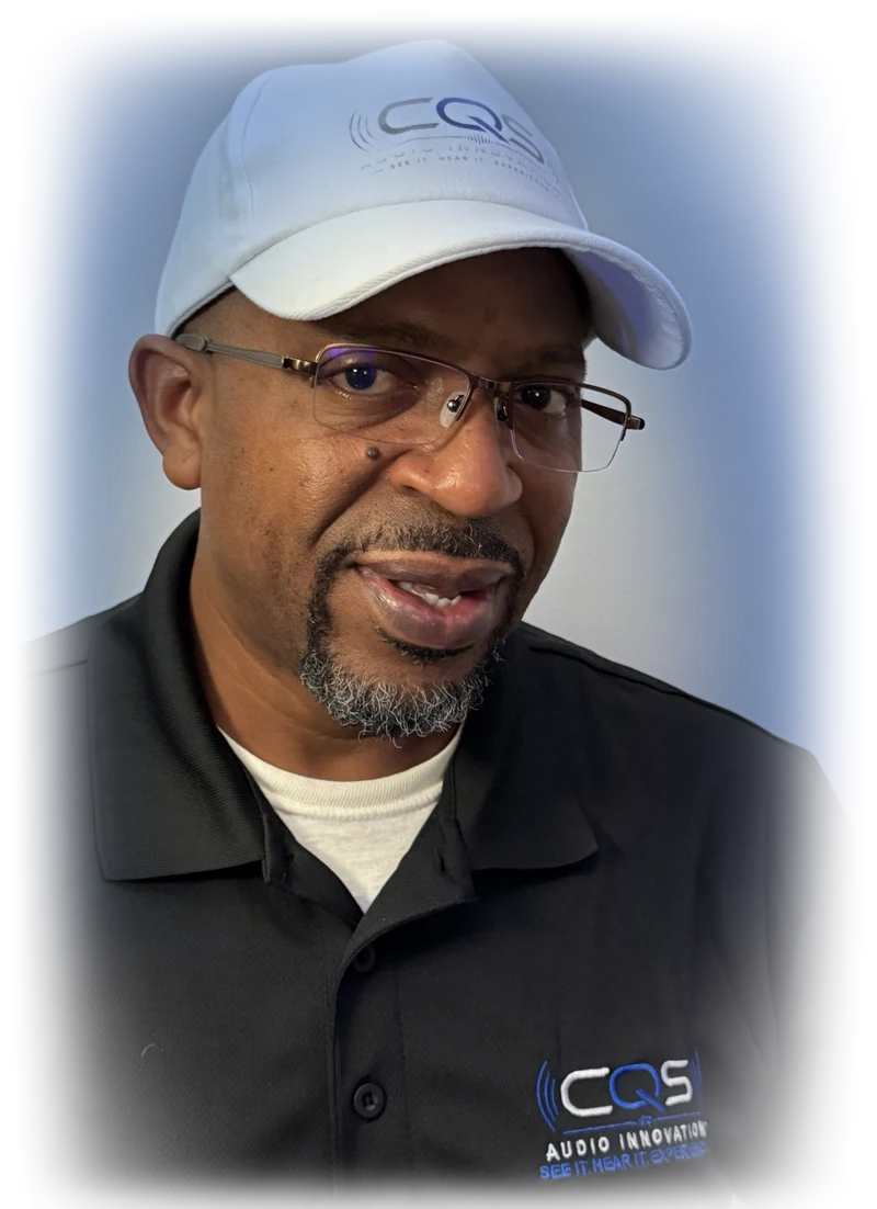 Quincy Sealy in a CQS Audio Innovations cap and shirt